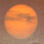 Transit of Venus - top right: Captured on June 5, 2012, this rough solar image catches the silhouette of Venus transiting the Sun. Because these planetary alignments occur in pairs separated by over a century, this image documents the last time any human alive today will witness Earth's twin pass directly across the solar disk until December 2117.